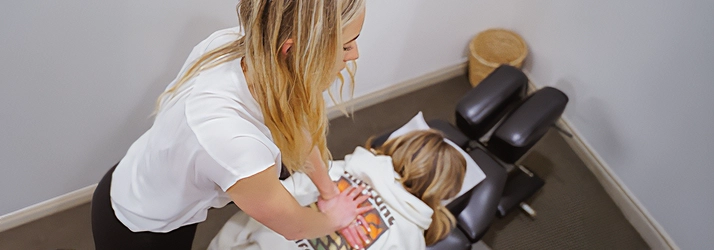 Chiropractor Chloé Lightner Adjusting A Patients Back
