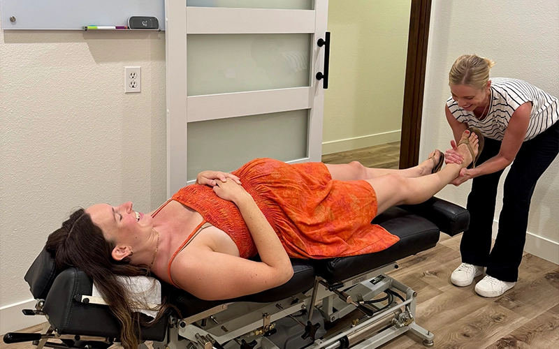 Chloé Lightner Examining A Pregnant Patient