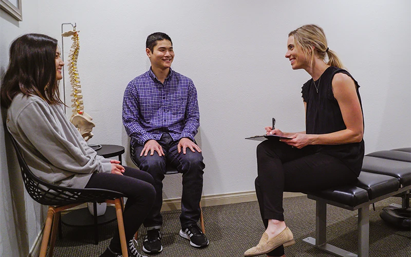 Chiropractor Chloé Lightner Meeting With Patients