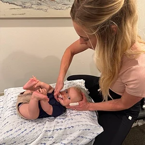 Chloé Lightner Adjusting Baby